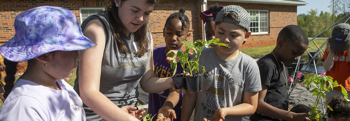 ACES helping in the garden at the Academy at Middle Fork. 